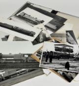 A folio containing early 20thc photographs of various trains such as the North British Locomotive