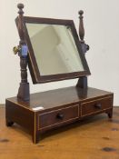 A 19th century boxwood strung mahogany toilet mirror, the rectangular frame swivelling between two