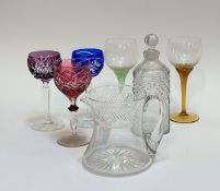 A mixed group comprising a decanter (h-22cm), a crystal jug, two long coloured stemmed flower headed