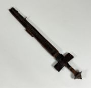 An African tuarey short sword and scabbard, steel pommel, leather covered hilt and handle, steel