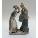 A Lladro glazed figure of The Gossips of two ladies whispering to each other. (h- 31cm w- 20cm) (