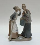 A Lladro glazed figure of The Gossips of two ladies whispering to each other. (h- 31cm w- 20cm) (