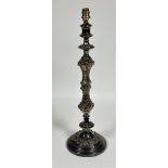 A Edwardian Epns chased baluster stem candle stick converted to table lamp on circular moulded base,