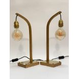 Tom Raffield, a pair of Wheal brass mounted oak table lamps, each with an Edison bulb on a bowed