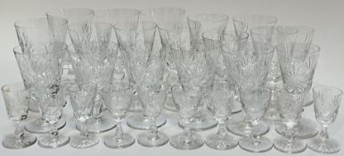 A mixed group of cut crystal drinking glasses comprising four large stem glasses (h- 14cm), six