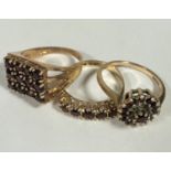 A 9ct gold twelve stone square claw set garnet cluster ring, P, a 9ct gold garnet cluster ring, P,