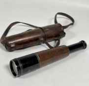 A 20thc four draw tapered telescope in leather case (30cm when in case)