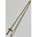 A 9ct gold plain crucifix, (L x 3cm) mounted on spiral rope pattern trace link chain, (L x 34cm) 5.