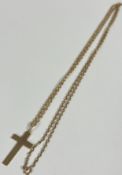 A 9ct gold plain crucifix, (L x 3cm) mounted on spiral rope pattern trace link chain, (L x 34cm) 5.
