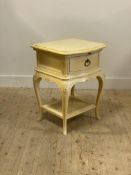 A French style cream painted bedside, fitted with a drawer above cabriole supports united by an
