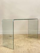 A contemporary line bent glass console table H70cm, W124cm, D40cm