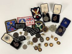 A mixed lot of shooting medals, buttons etc. (a lot)