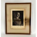 A photograph portrait of Adolf Hitler in uniform, framed, unglazed (a/f) (54 x 43cm)
