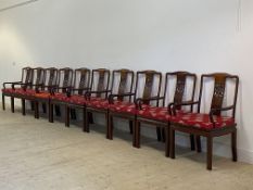 A set of ten Chinese hardwood dining chairs, with pierce carved splat back over panel seat, raised