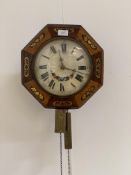 A 19th century wag on the wall clock, the octagonal birch and rosewood veneered case with floral