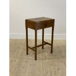 A Georgian style mahogany side table, with single frieze drawer raised on faceted supports united by