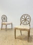 A pair of painted side chairs in the manner of Robert Adam, with ivory damask upholstered seats,
