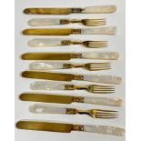 A Edwardian gilded part set of six mother of pearl handled fruit knives and five forks, ( knives L