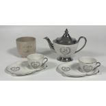 A Royal Winton Grimwades 25th Anniversary silver tea pot (h-21cm), two cups and two saucers with