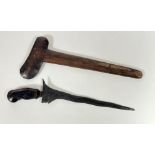 A Kris dagger, probably Japanese, carved wooden handle with stone set mount, wavy steel blade and