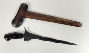 A Kris dagger, probably Japanese, carved wooden handle with stone set mount, wavy steel blade and