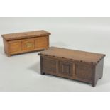 An oak miniature coffer style kist cigarette box, the hinged top enclosing a twin section with brass