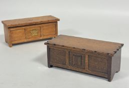 An oak miniature coffer style kist cigarette box, the hinged top enclosing a twin section with brass