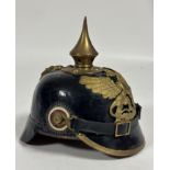 A good quality reproduction WWI German leather Picklehaub with Baden helmet plate with brass