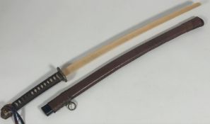 A Japanese army officer's military sword, bound handle with brass fitting and tsuba, later wooden
