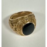 A 10k gold American Army Air Forces Class style ring set oval onyx to top, enclosed in rub over