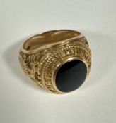 A 10k gold American Army Air Forces Class style ring set oval onyx to top, enclosed in rub over