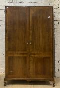 An Early 20th century mahogany wardrobe, with two cross banded doors enclosing shelves and hanging