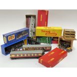 A group of model trains and cars comprising three Hornby Dublo train carriages (l- 23cm), a box of