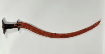 An Ethiopian shotel, 20thc., hardwood handle with curved steel blade and leather scabbard (87cm)