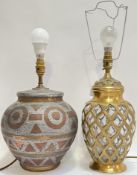 A globular ceramic lamp with abstract paper-resist decoration (height including bulb 44cm, w- 25cm),