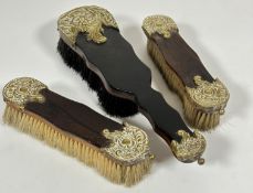 A walnut set of three brass mounted clothes and hair brushes, ( largest L x 30cm) (3)