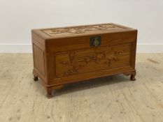 A Chinese hardwood blanket box, the top and panelled front carved with birds and blossom trees,