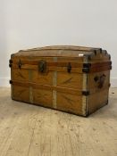 A late 19th century wood and metal bound dome top trunk, decorated with tooled leather, L94cm