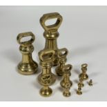 A selection of eleven Avery Ltd/ H.Pooley & Son Ltd brass weights varying from 14 pounds to 1/