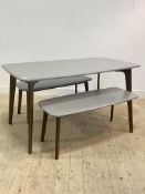 A contemporary dining table, the grey top raised on stained oak tapered and splayed supports (H76cm,