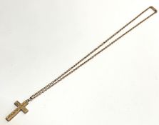 A 9ct gold engraved cross pendant on 9ct gold trace link chain with barrel clasp fastening, (L x