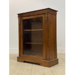 A Victorian boxwood strung walnut pier cabinet, with floral cast gilt metal mounts flanking a glazed