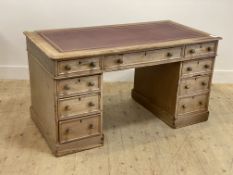 A late Victorian bleached mahogany twin pedestal desk, the top inset with tooled skiver over one