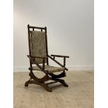 An early 20th century walnut framed American style rocking chair H109cm