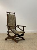 An early 20th century walnut framed American style rocking chair H109cm