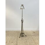 An Edwardian brass telescopic lamp standard, the central stem issuing three branches with glass