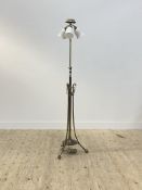 An Edwardian brass telescopic lamp standard, the central stem issuing three branches with glass