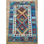 A Chobi Kilim rug of typical design 145cm x 96cm