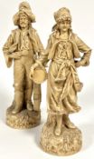 A pair of Edwardian continental porcelain musician travelling figures both dressed in early 19thc