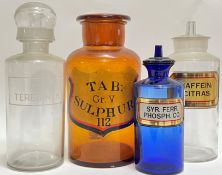 A group of four glass apothecary jars of various colours (clear, blue, tobacco) (tallest h- 27cm)